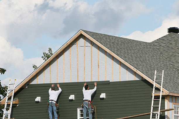 Professional Siding technician working in Derwood, MD